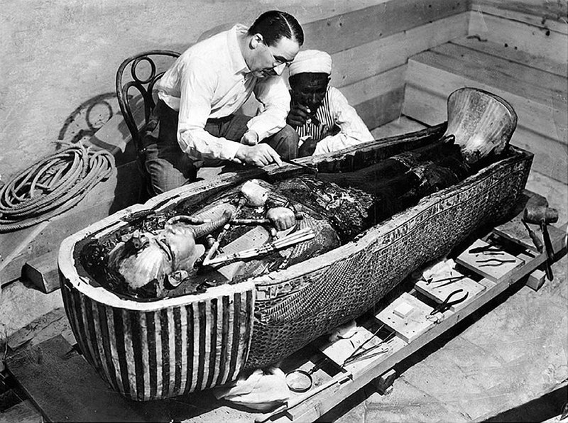 Howard Carter inspects Tutankhamun’s mummy, 1922. 
The New York Times. Public Domain.